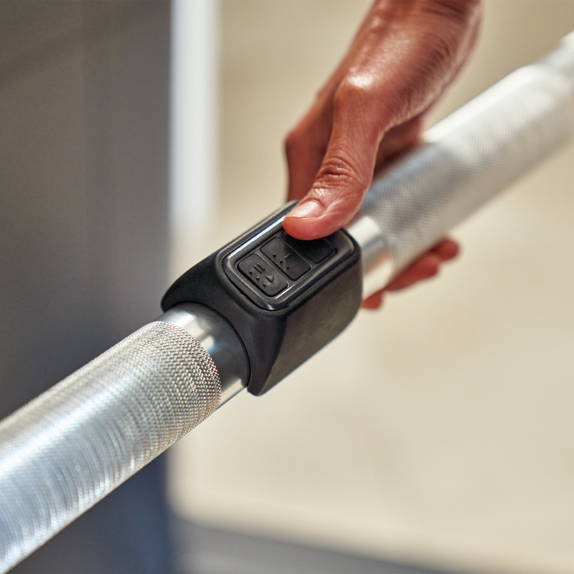 Echelon Strength Pro cable resistance machine close up of barbell resistance controls