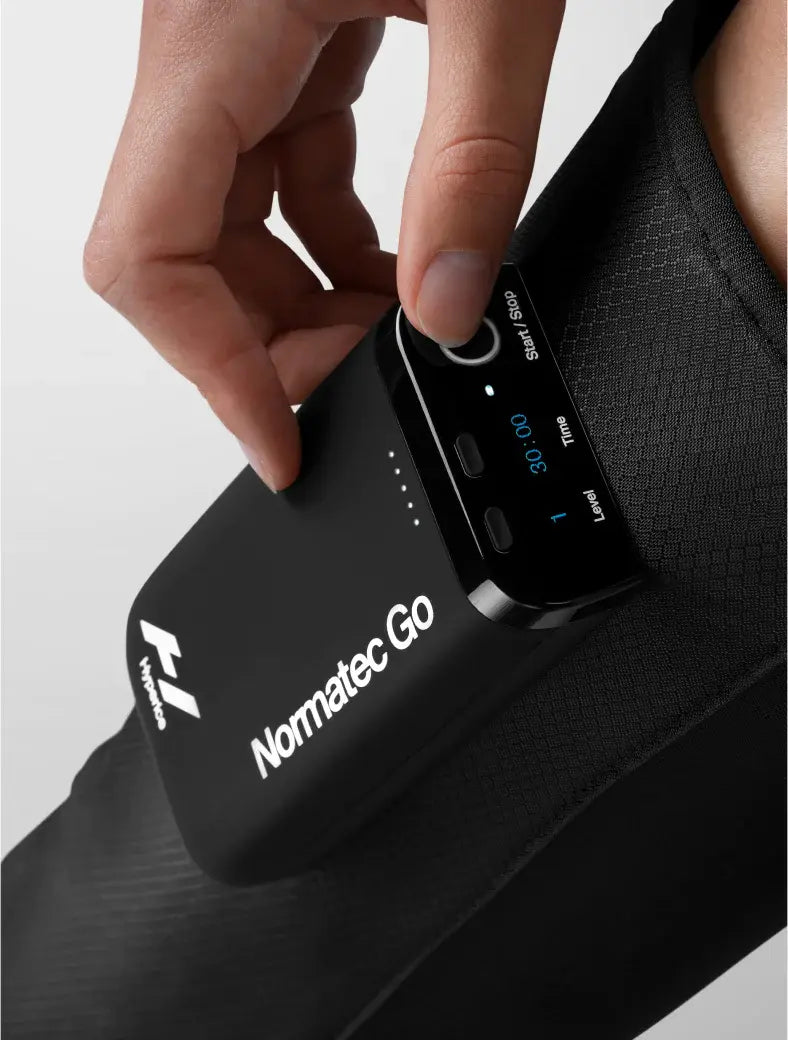 Close up of a person using the Normatec Go by Hyperice