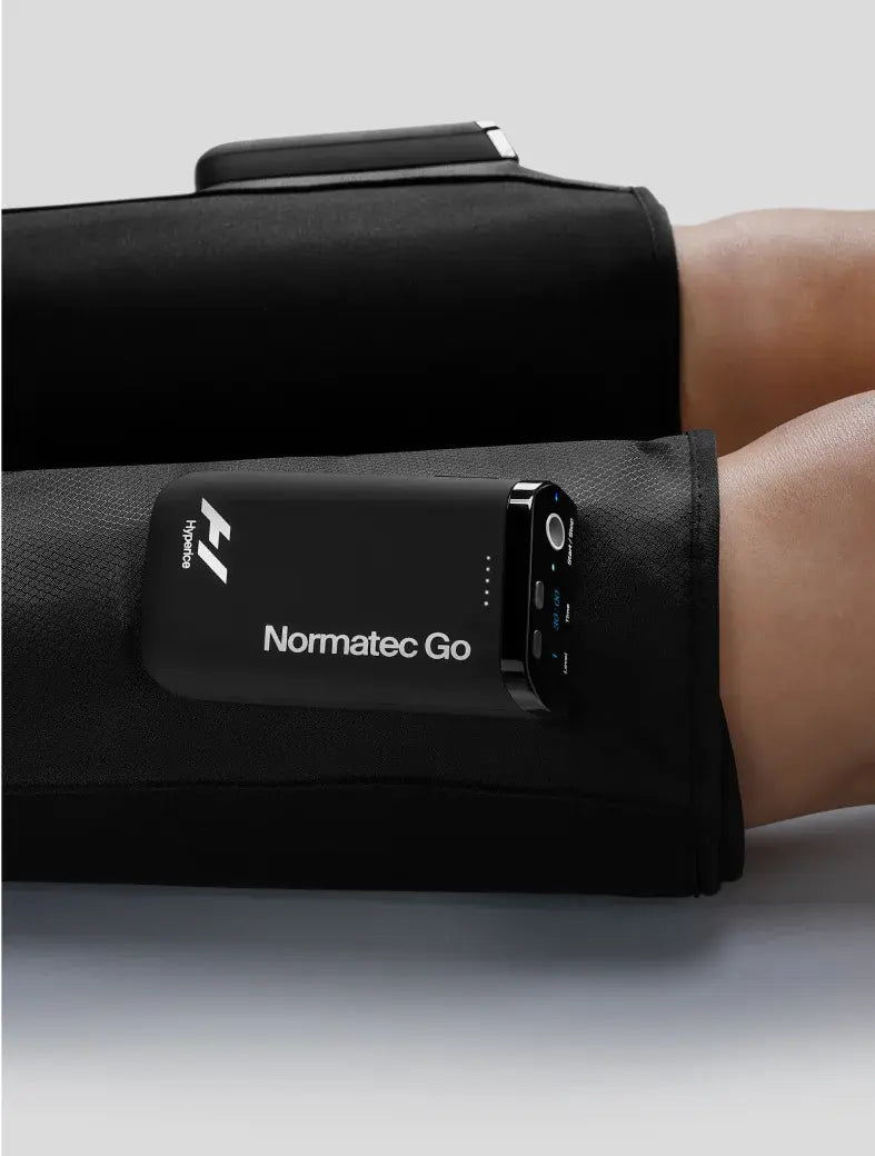 Close up of a person using the Normatec Go by Hyperice